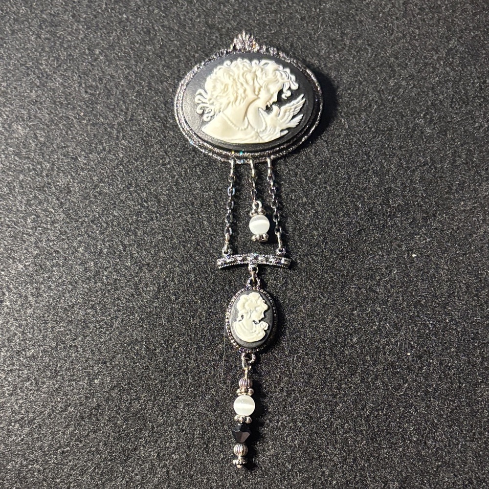 Elegant Silver and White Cameo Brooch